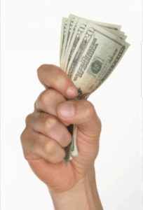 Hand holding twenty dollar bills
