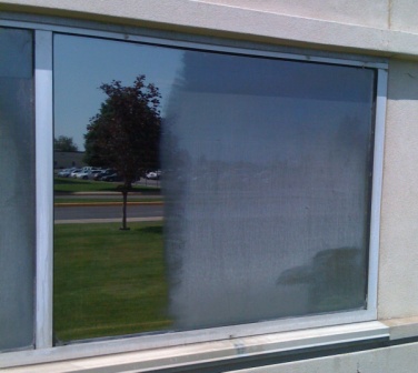 Hard water stains on picture frame wind