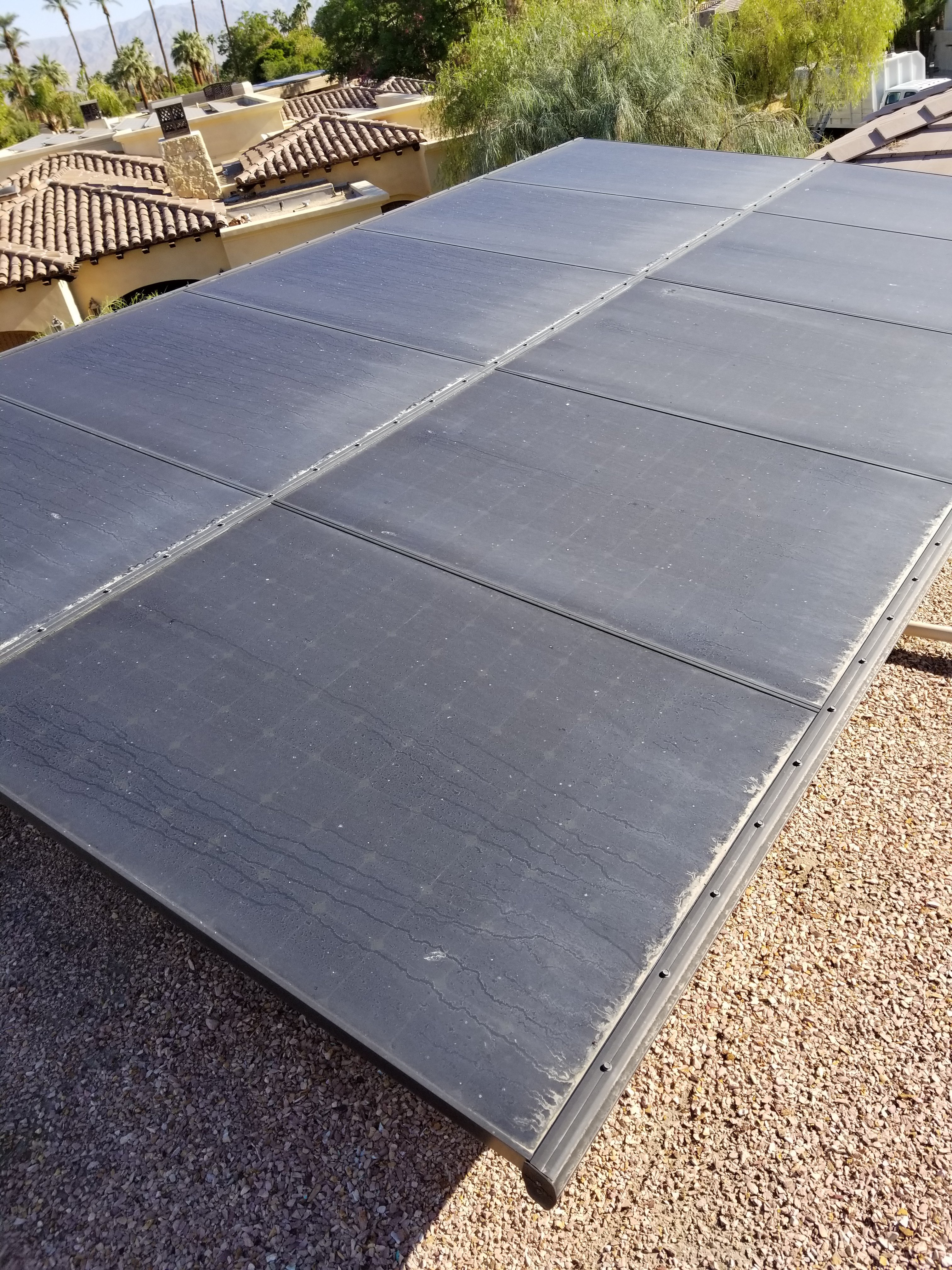 Dirty solar panels before a cleaning on home in Palm Springs, California 